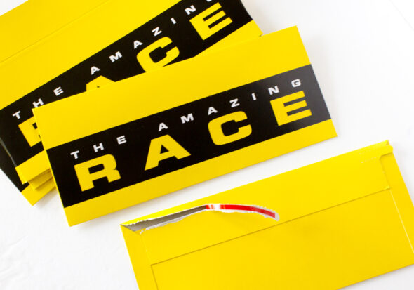 Amazing Race tear-strip envelopes