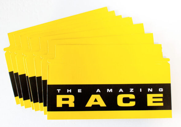 Amazing Race tear-strip envelopes