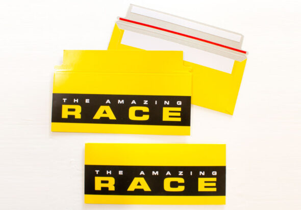 Amazing Race tear-strip envelopes